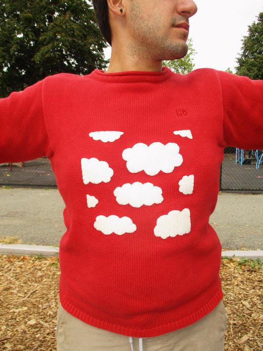 red sweater with clouds